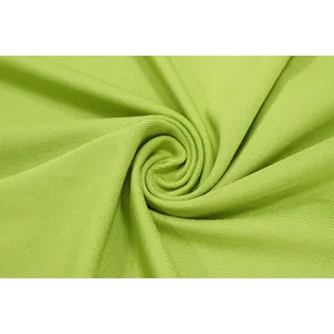 Detailed macro view of the lime green ribbed fabric texture for summer slim fit dresses