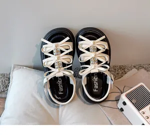 Girl's white bow sandals with thick soles and rhinestone accents for summer