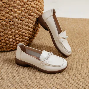 Comfortable beige women's loafers with soft ox tendon sole and decorative twist detail