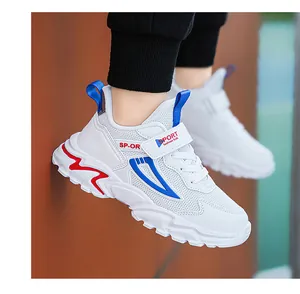 Detail of breathable white mesh kids' sneakers with blue and red accents shown on-foot.