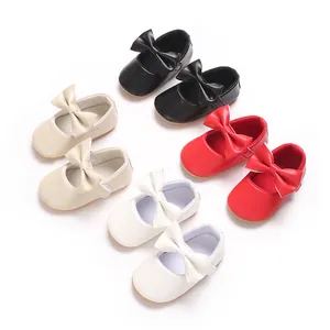 Variety of baby girl pre-walker shoes with bows in black, cream, red, and white colors