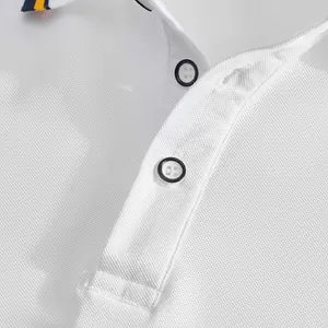 Close-up detail of a white pique mesh polo shirt showing placket buttons and fabric