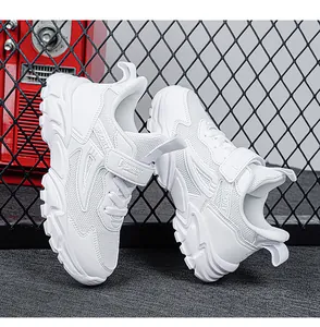 Detailed view of white children's sneakers featuring breathable mesh and hook-and-loop straps.