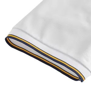 Detailed view of breathable mesh polo shirt cuff featuring navy and yellow stripes.