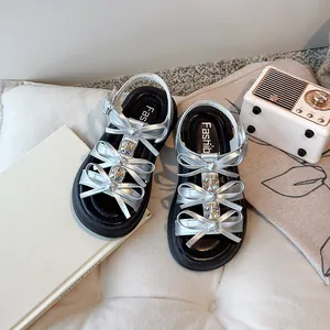 Stylish silver girl's platform sandals with cute butterfly bows and rhinestone accents