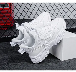 Detailed macro view showing the textured white finish and strap of the kids sports shoes