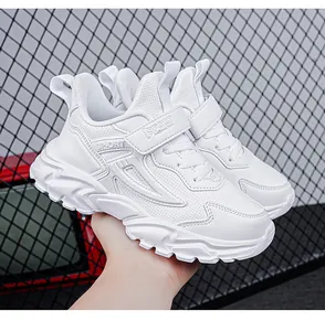 Detailed view of stylish white breathable kids sports sneakers with hook and loop strap