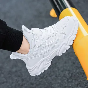 Classic white children's sneakers featuring breathable mesh and shock-absorbing sole