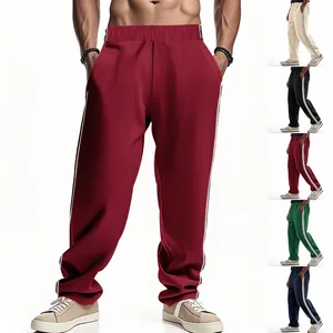 Close-up view of men's loose athletic joggers with side stripes in multiple colors