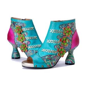 Handmade leather peep-toe ankle boots with 3D floral accents and ethnic patterns.