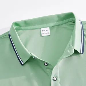 Close-up of green men's golf polo shirt collar with 100% polyester tag