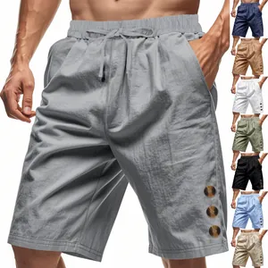 Detail of men's loose linen shorts with drawstring waist and color variants