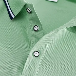Close-up of the light green polo shirt neckline showing mesh texture and buttons.