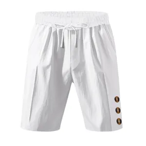 Front view of white men's linen beach shorts with elastic drawstring waist and side buttons