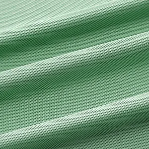 Close-up of breathable green mesh fabric texture for men's quick-dry polo shirt