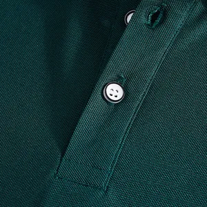 Macro detail of dark green breathable mesh fabric on a men's quick-dry polo shirt