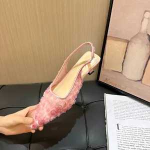 Detailed macro view of pink mesh lace slingback pump with elegant floral embroidery