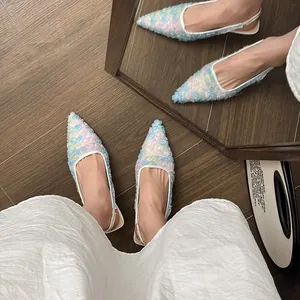 Detailed view of women's colorful French lace mesh pointed-toe slingback high heels