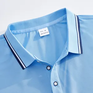 Detailed view of light blue mesh polo shirt collar with size M label showing 100% polyester.
