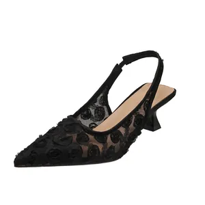 Elegant side view of black lace pointed toe slingback kitten heels with floral mesh detail