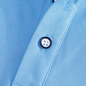 Close-up macro detail of blue mesh fabric and button on men's quick-dry golf polo shirt