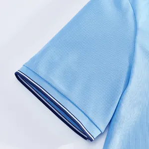 Close-up of light blue mesh polo shirt sleeve with a detailed striped ribbed cuff