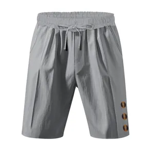 Grey casual linen-style shorts with drawstring waist and button details