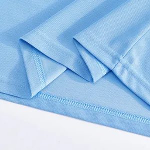Close-up of light blue quick-dry mesh fabric detail on a men's golf polo shirt
