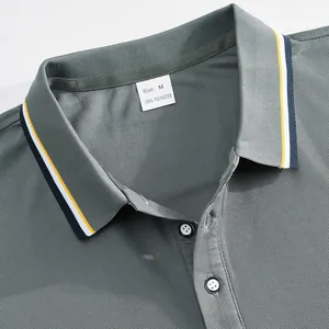 Close-up detail of a grey quick-dry mesh polo shirt collar with size M polyester label