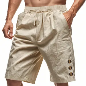 Detailed macro view of men's casual linen shorts featuring drawstring and buttons
