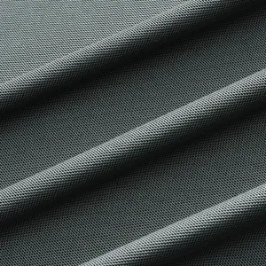 Macro view of breathable grey mesh fabric texture for a quick-dry golf Polo shirt