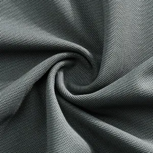 Close-up macro view of breathable grey mesh fabric on men's quick-dry golf polo shirt