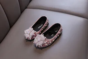 Detail view of sparkling pink rhinestone princess shoes for girls with floral toe