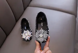 Elegant girl's princess flats featuring shimmering rhinestone snowflake and pearl details