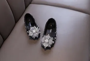 Elegant black princess shoes for girls with sparkling rhinestone flower and pearl accents
