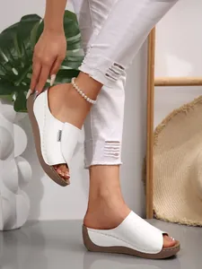 Stylish women's white open-toe wedge sandals with thick platform soles in casual style