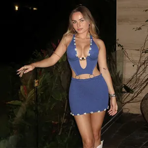 Close-up detail of sexy blue knitted beaded cutout bodycon halter dress for women