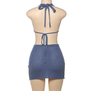 Detail view showing the back of this blue knitted sexy halter neck dress with ties.