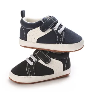 Navy blue canvas baby sneakers with white stripes and soft non-slip soles for boys