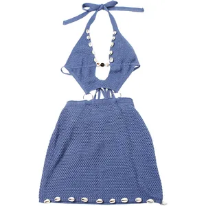 Blue crocheted halter mini dress featuring white shell beads and sexy waist cutouts