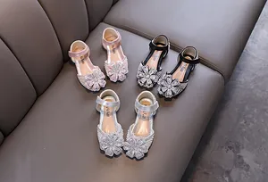 Elegant girls' rhinestone princess shoes displayed in pink, black, and silver colors