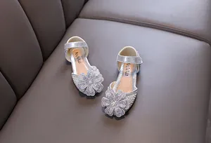 Elegant silver girls princess shoes featuring sparkling rhinestone flower decorations