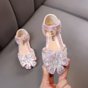 Sparkling pink princess shoes for girls with large rhinestone flower and pearl details