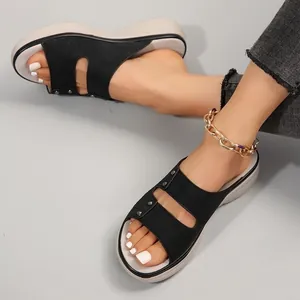 Stylish women's black platform slide sandals with cutout straps and rivet details