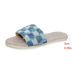 Detailed view of women's denim checkerboard flat slippers with 2cm heel height specification