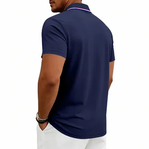 Close-up showing the back of a navy blue quick-dry polo shirt with striped collar detail