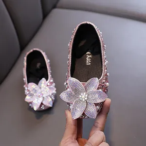 Pink rhinestone princess shoes for girls with large sparkly flower detail for dance parties.