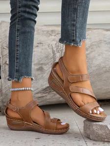 Women's casual brown wedge sandals with Velcro straps and contrast white stitching