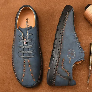 Blue hand-stitched men's casual leather shoes with lace-up design and tree logo