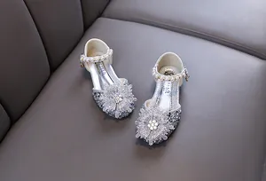 Sparkling silver princess dress shoes for girls with rhinestones and pearl flower detail